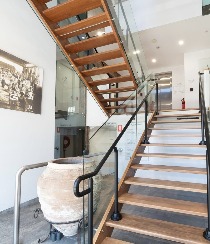U-shaped staircase in a modern office setting.