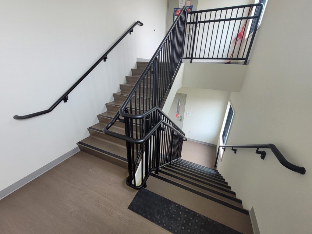 A stairwell with handrails and railings for safety.
